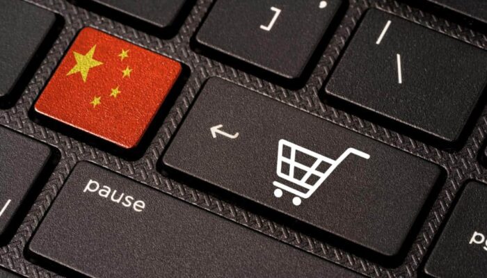 Chinese flag and shopping cart on keyboard