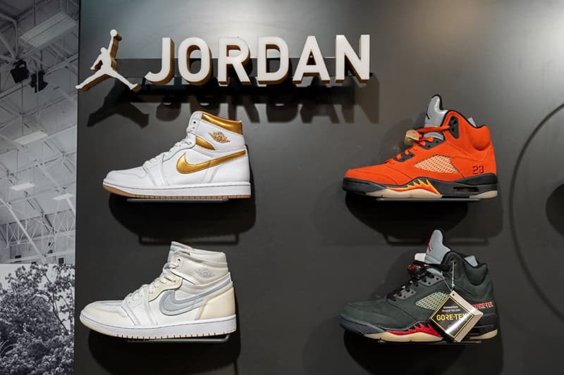 Nike Air Jordan logo and basketball shoes display in the interior of a sports shoe store_1